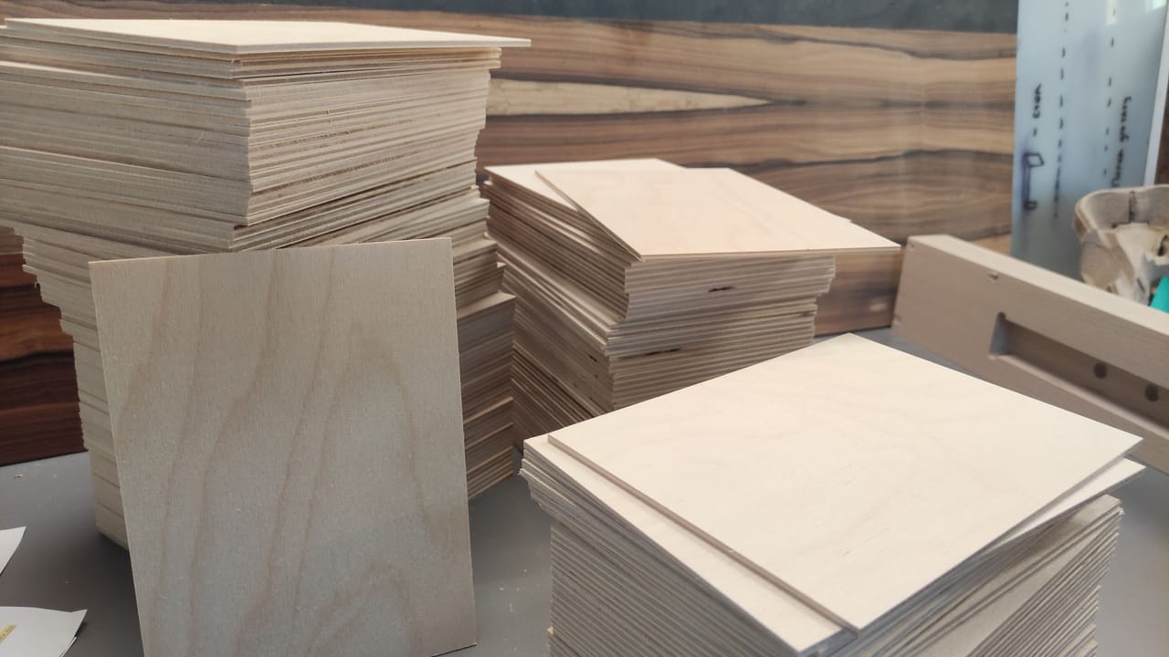 Stacks of birch plywood parts in different formats