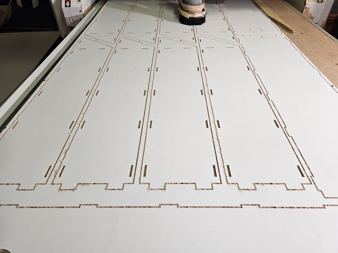 Plywood sheet nested with box parts and finger joints, cut on the CNC router