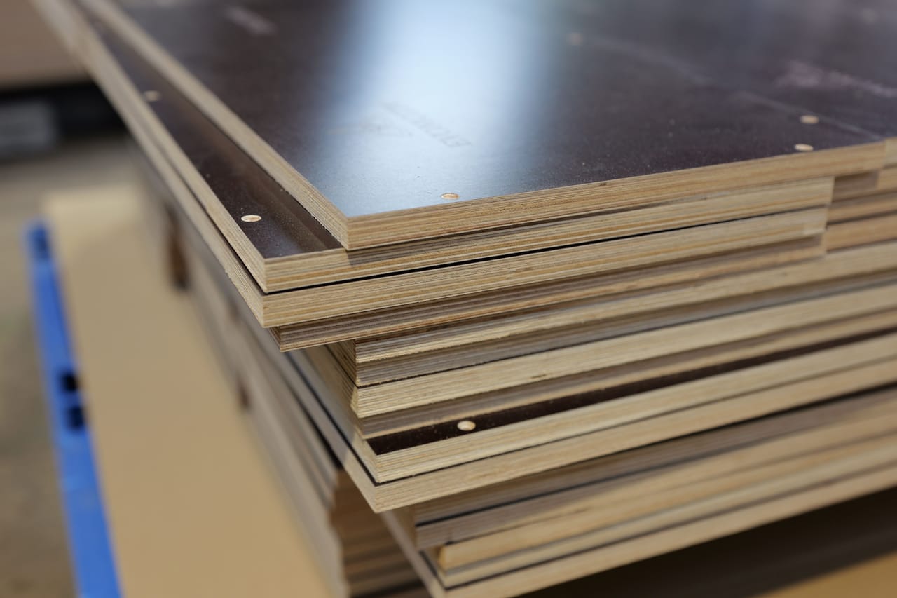 Close-up of the layered edges of a stack of film-faced plywood